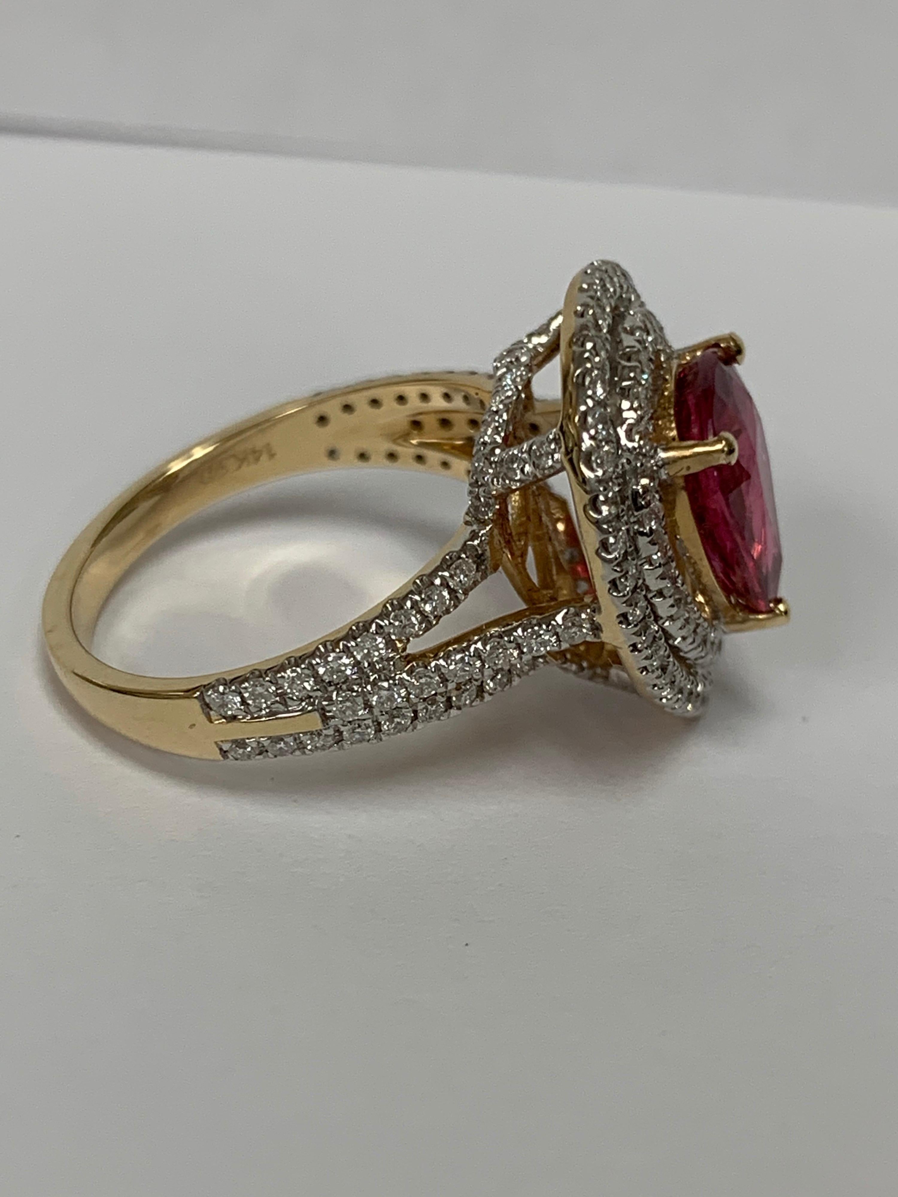Pear shape Natural Ruby set in 14 Karat yellow gold is one of a kind Ring. The Ruby is 2.55 Carat and White Round Diamonds are 0.78 Carat . Currently Size of the Ring is 7 and can be resized if needed.
