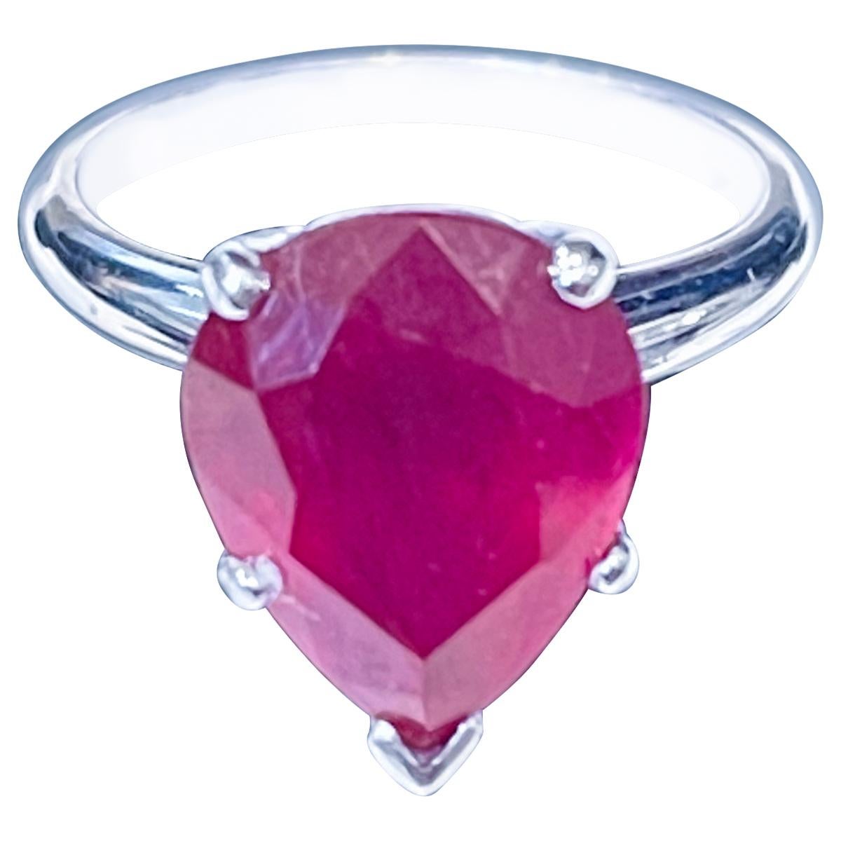 12X10 Pear  Cut  approximately 4.5 Carat Treated Ruby  14 Karat White Gold Ring Size 5
Its a treated ruby
 prong set
14 Karat White  Gold: 3.9 gram
Ring Size 5 ( can be altered for no charge )
Simple ring for the people  who don't like bling of