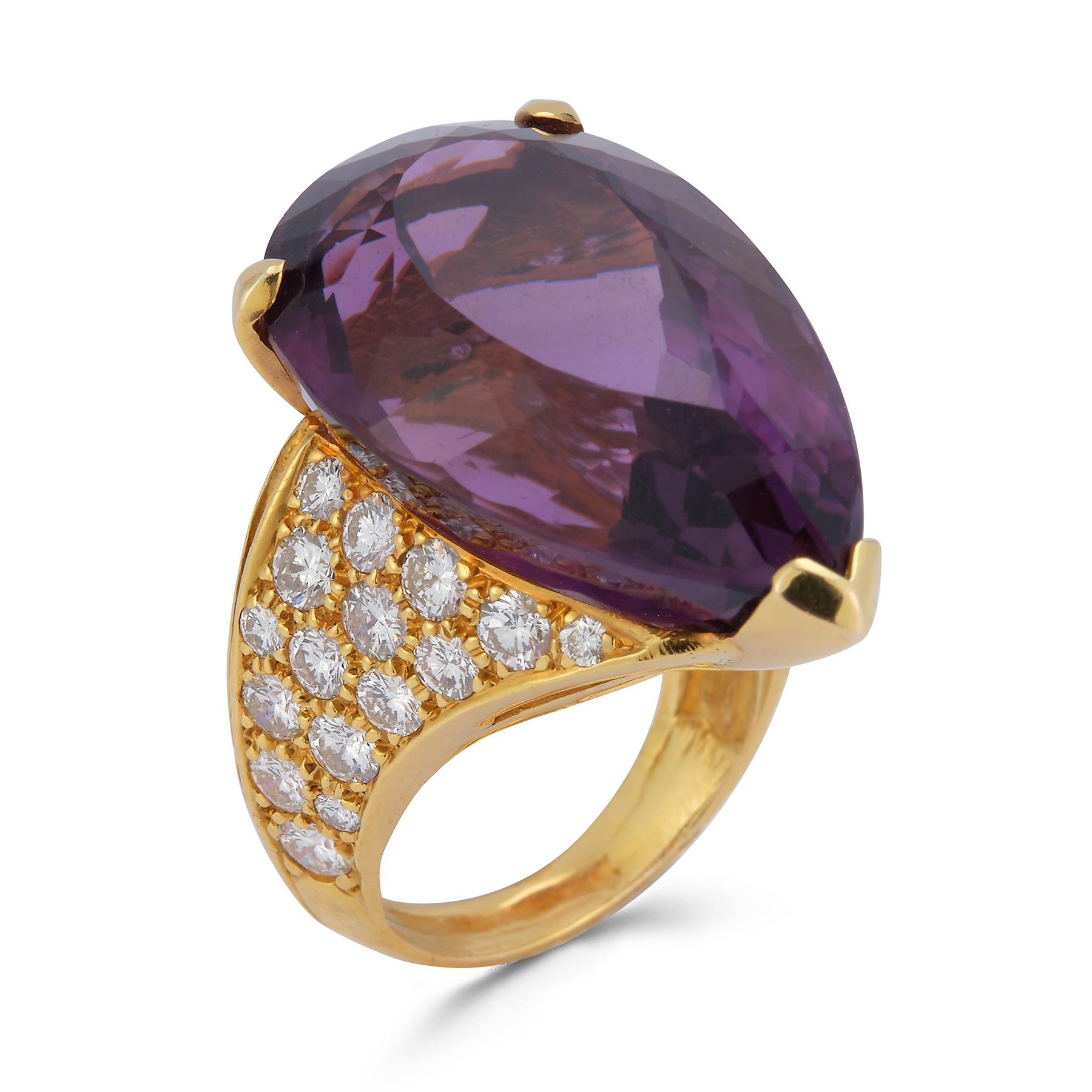 Huge Pear Shape Amethyst Cocktail Ring 

1 large amethyst set in 3 prong setting surrounded by 50 round cut diamonds approximately 3.86 cts set in 14k yellow gold.

Ring Size: 5

Re sizable free of charge 

