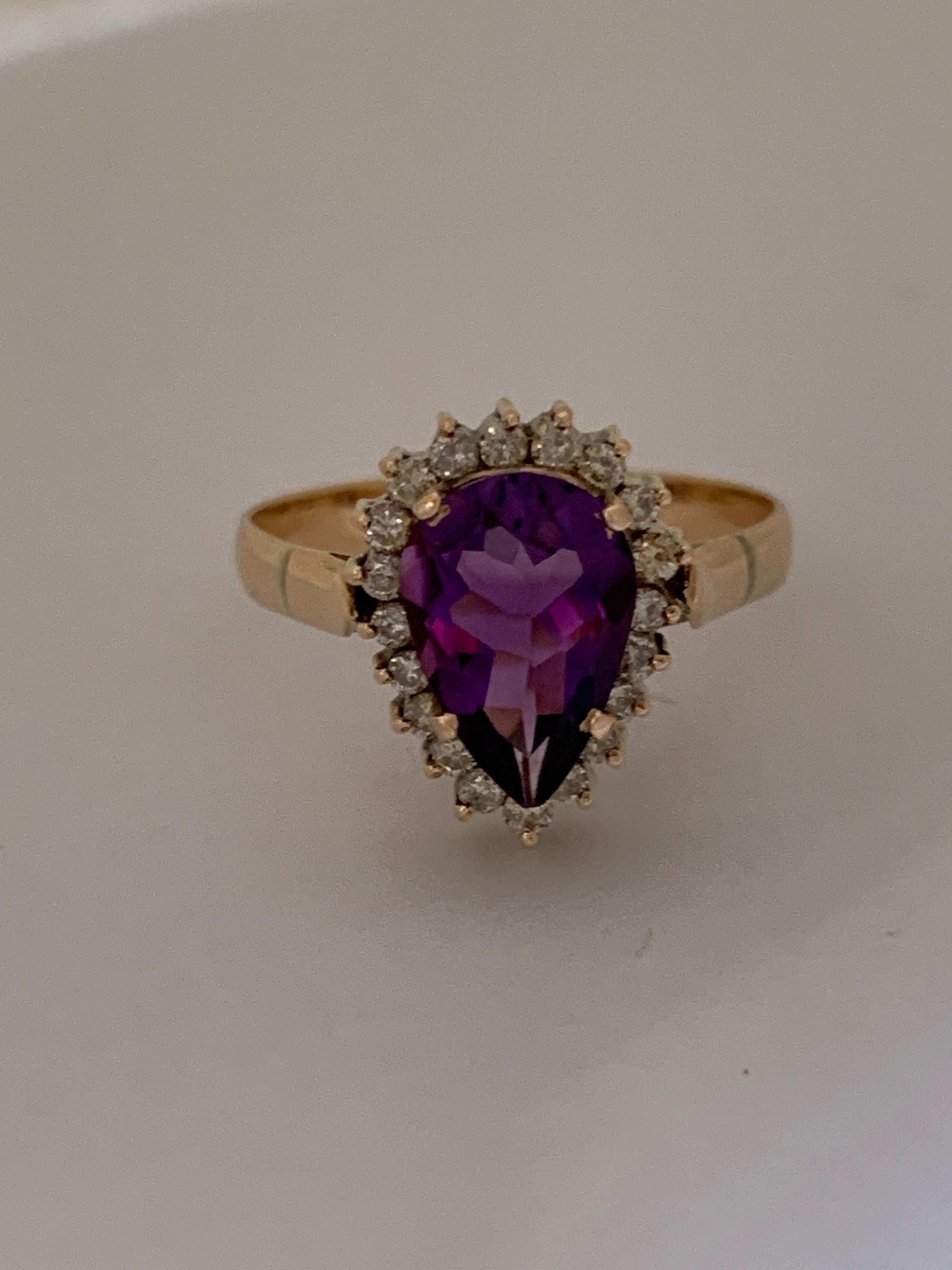 Natural Even color Amethyst measures 7mm X 9 mm  and  Approx. 0.50 Carat Diamonds set in 14 Karat yellow gold is one of a kind hand crafted Ring, The size of the ring is 6.5 but can be resized if needed. 