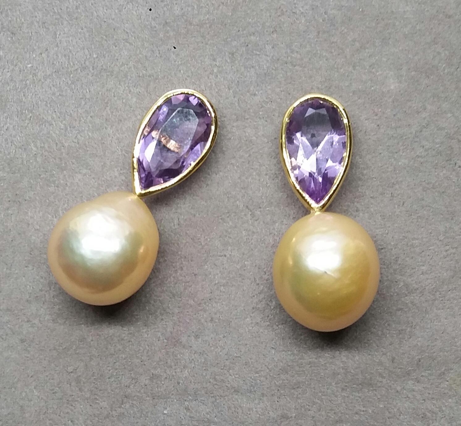  These simple but elegant and completely handmade earrings have 2 faceted Pear Shape Natural Amethysts measuring 7x12 mm set in yellow gold bezel at the top to which are suspended 2  Natural Cream Color Baroque Pearls measuring 11 x 13 mm.

In 1978