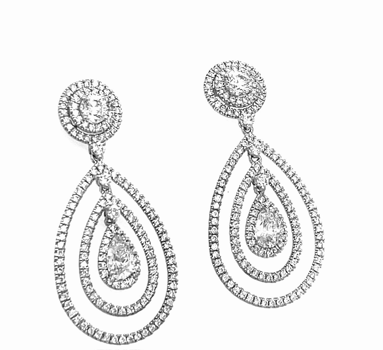 Pear Shape and Round Diamond Dangling Earrings 18K White Gold

Pear shape weighs 0.48 carat E Color SI1 Clarity

With Stuller Certificate # 203165

Pear shape weighs 0.51 carat E Color SI2 Clarity

With GIA Certificate # 1149357354

Round Brilliant
