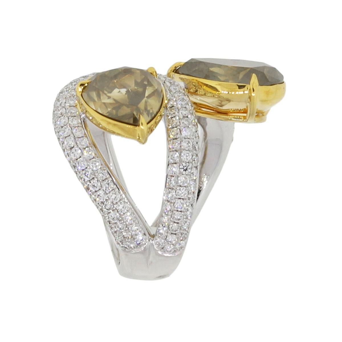 Material: 18k white gold
Diamond Details: GIA certified 4.81ct pear shape diamond. Diamond color is fancy dark brown-greenish yellow. GIA# 5161963436
                             GIA certified 3.72ct pear shape diamond. Diamond is fancy brown-yellow