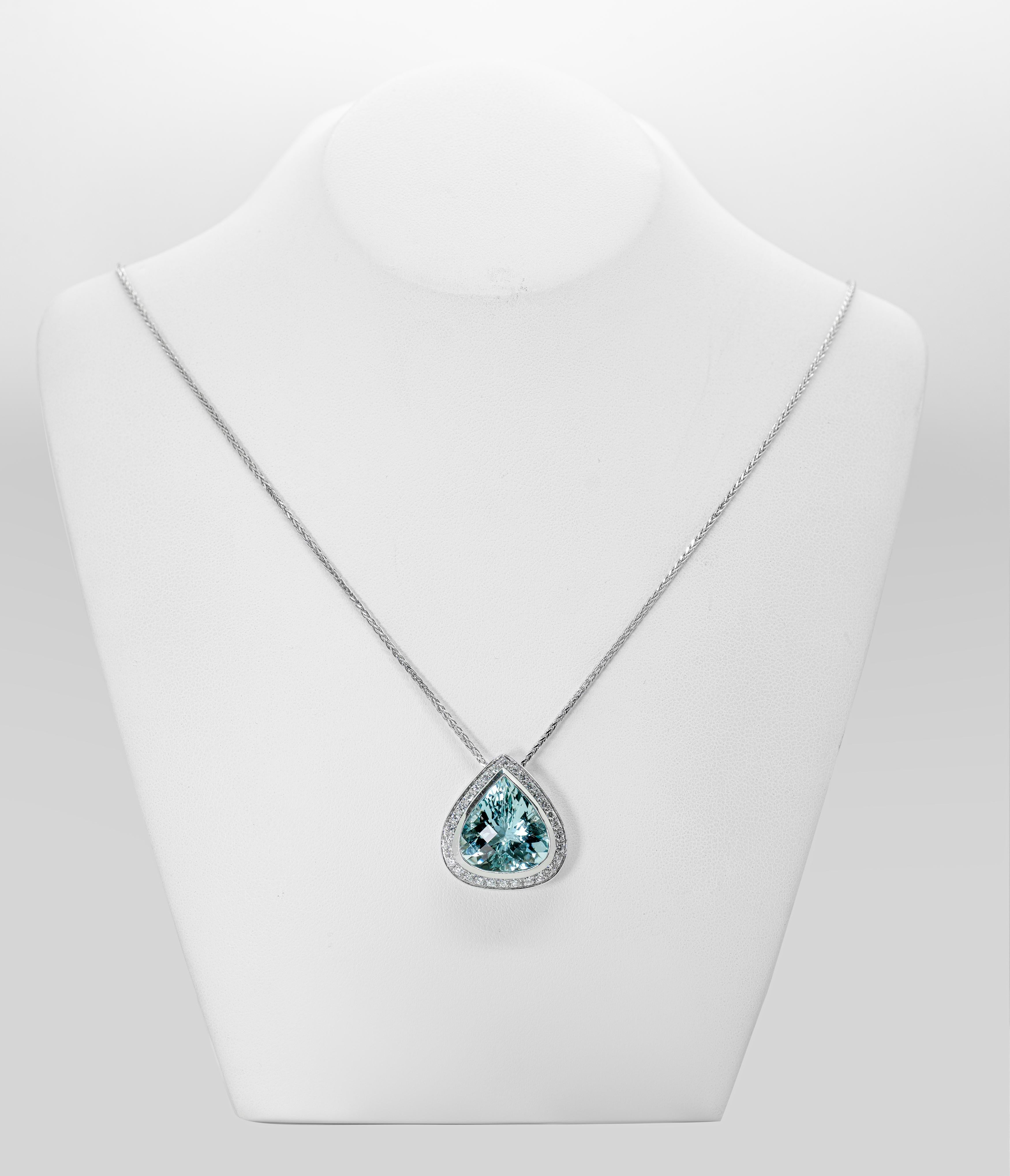 the exquisite beauty of solid gold pear cut aquamarine pendant