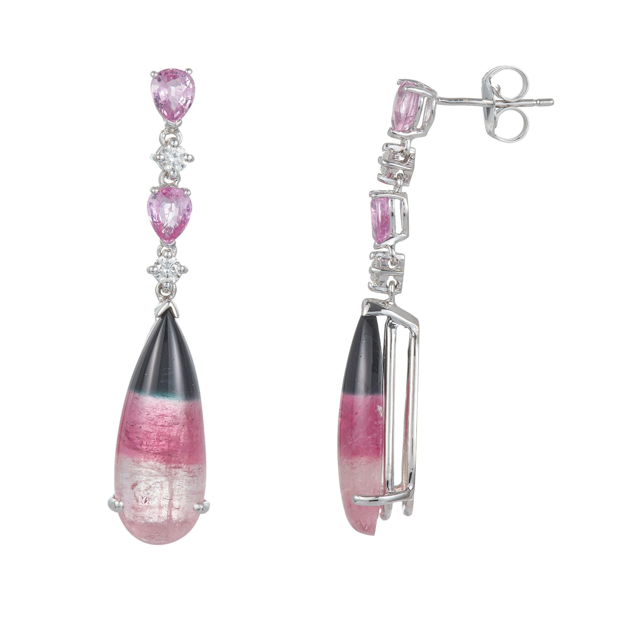 Stones: 2 Pear Shape Tourmaline 12.46 Carats Total Weight
Accent Stones: 4 Pear Shape Pink Sapphire 1.68 Carats Total Weight
Accent Stones: 4 Round Brillant Diamonds at 0.65 Carats Total Weight - Color- SI/ Clarity: H-I
Metal: 14K White Gold

Fine