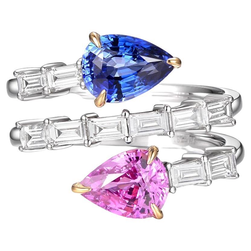 Introducing our stunning ring, featuring a unique design that will surely capture your heart! This exquisite piece showcases a captivating 1.06 carat pink sapphire and a striking 1.13 carat blue sapphire, both delicately set on each end of the ring,