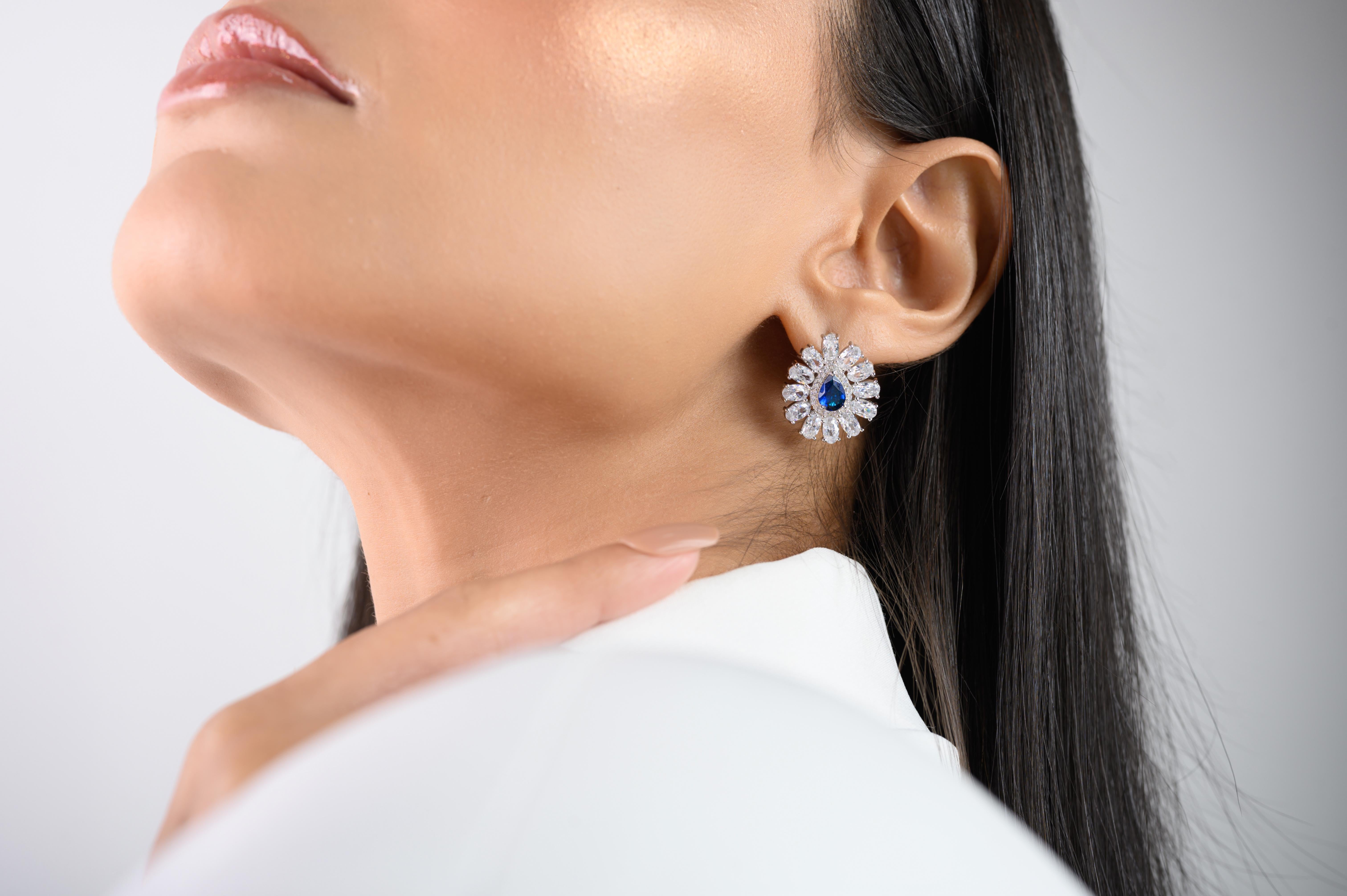 Pear Shape Blue Color Rhinestone Studs Earring in sterling silver. You shall need these statement studs earring to make a statement with your look. Each piece features dazzling cubic zirconia stones, renowned for their brilliance and clarity, set in