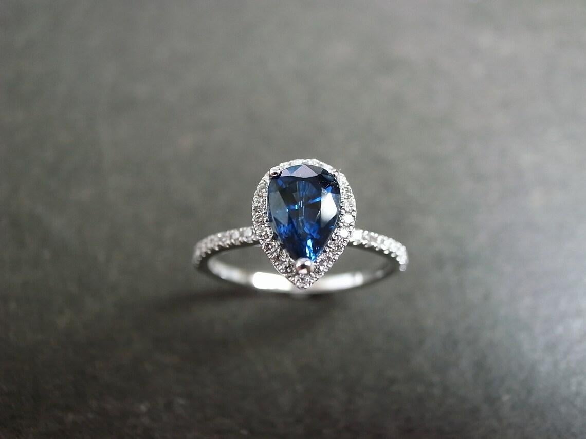 For Sale:  Pear Shape Blue Sapphire and Round Brilliant Cut Diamond Engagement Ring  4