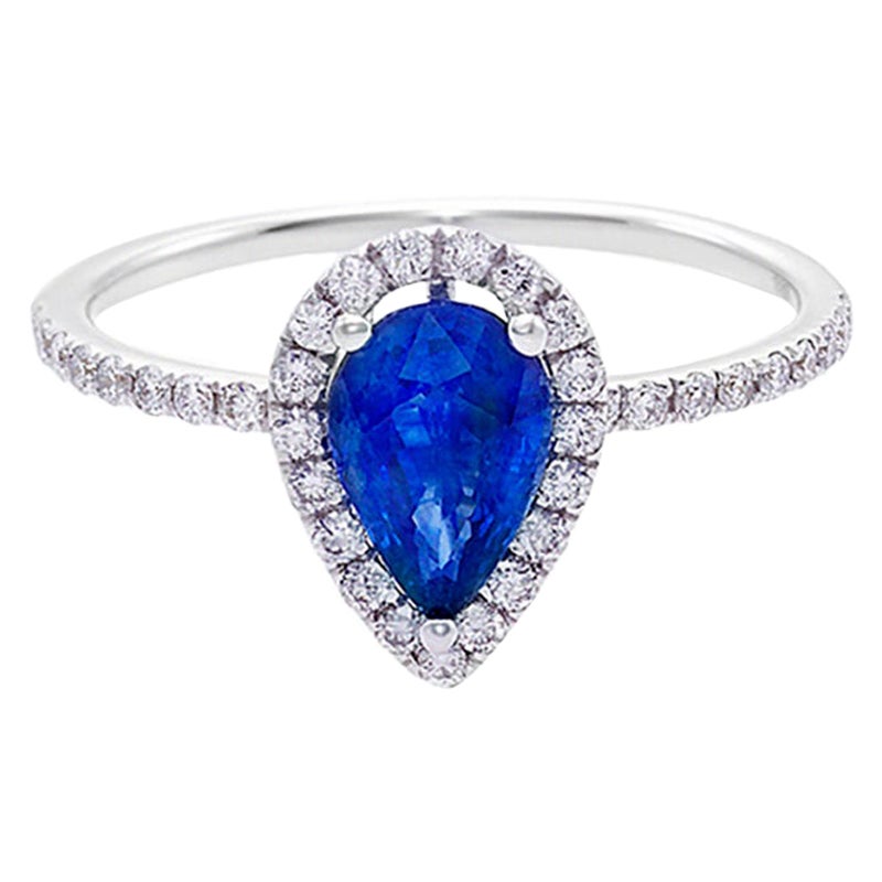 Anello di fidanzamento con zaffiro blu a forma di pera e diamante tondo taglio brillante
