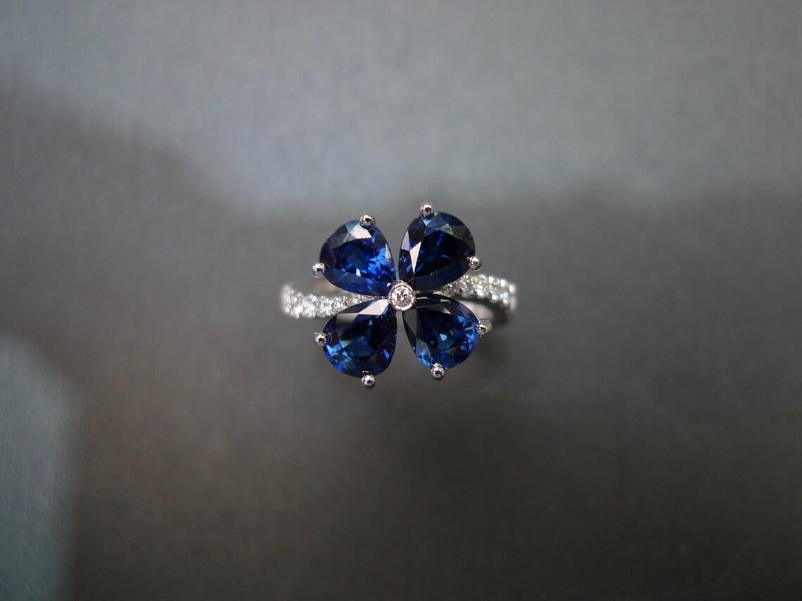 For Sale:  Pear Shape Blue Sapphire Diamond Twist Tension Style Floral Engagement Ring 7