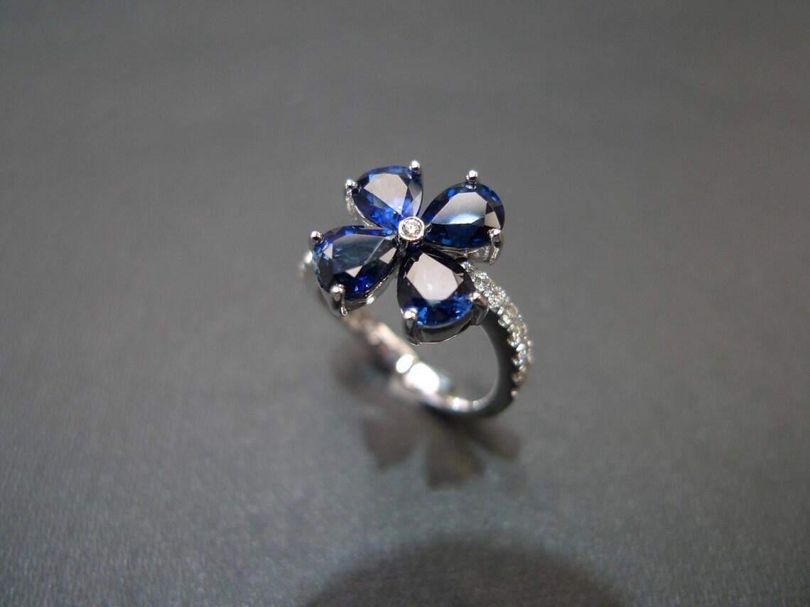 For Sale:  Pear Shape Blue Sapphire Diamond Twist Tension Style Floral Engagement Ring 8