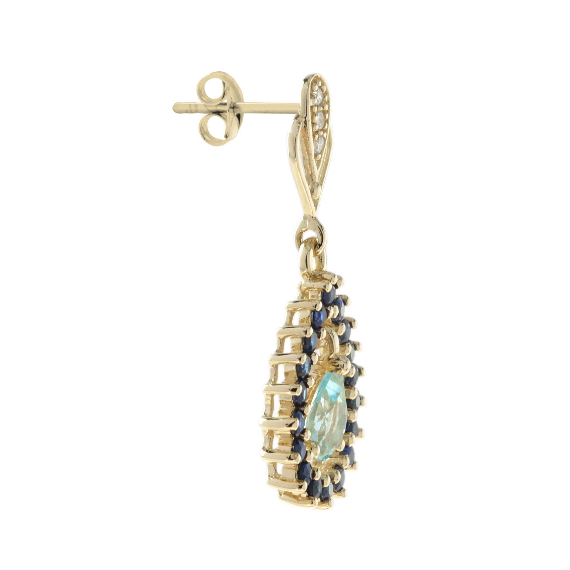 Suspending two pear shaped blue topazes, accented by sapphires openwork frames and stations set with round diamonds. 14K Yellow Gold.
Information
Style: Art Deco
Width: 13 mm.
Length: 31 mm.
Weight: 5.87 g. (approx. in total)
Backing: Push