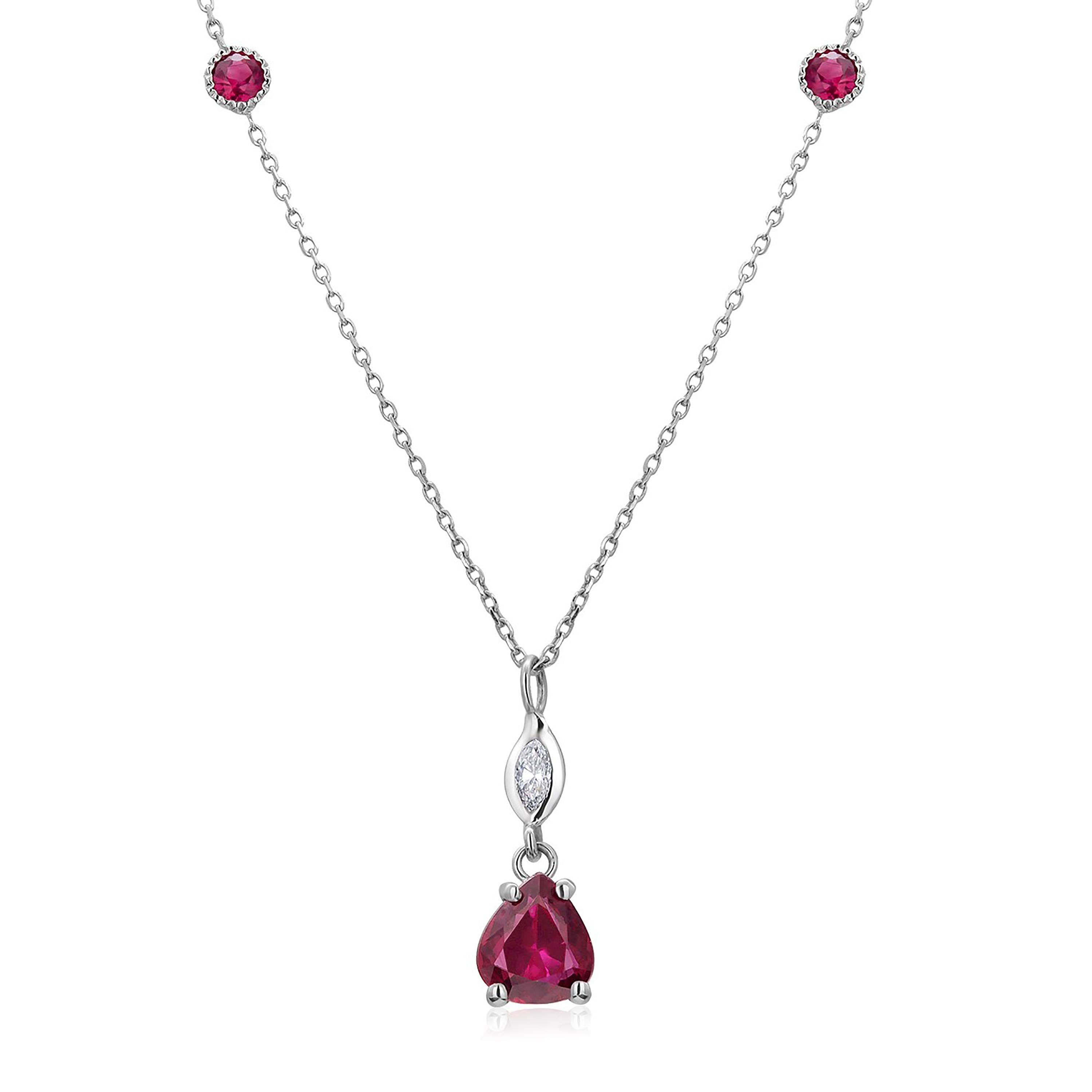 Fourteen karats white gold trending layered necklace pendant with hanging pear-shaped red ruby
One pear shape ruby weighing 0.93 carat
Two round-shaped ruby  weighing 0.30 carats bezel set with fine millgrain edge 
Marquise diamond weighing 0.10