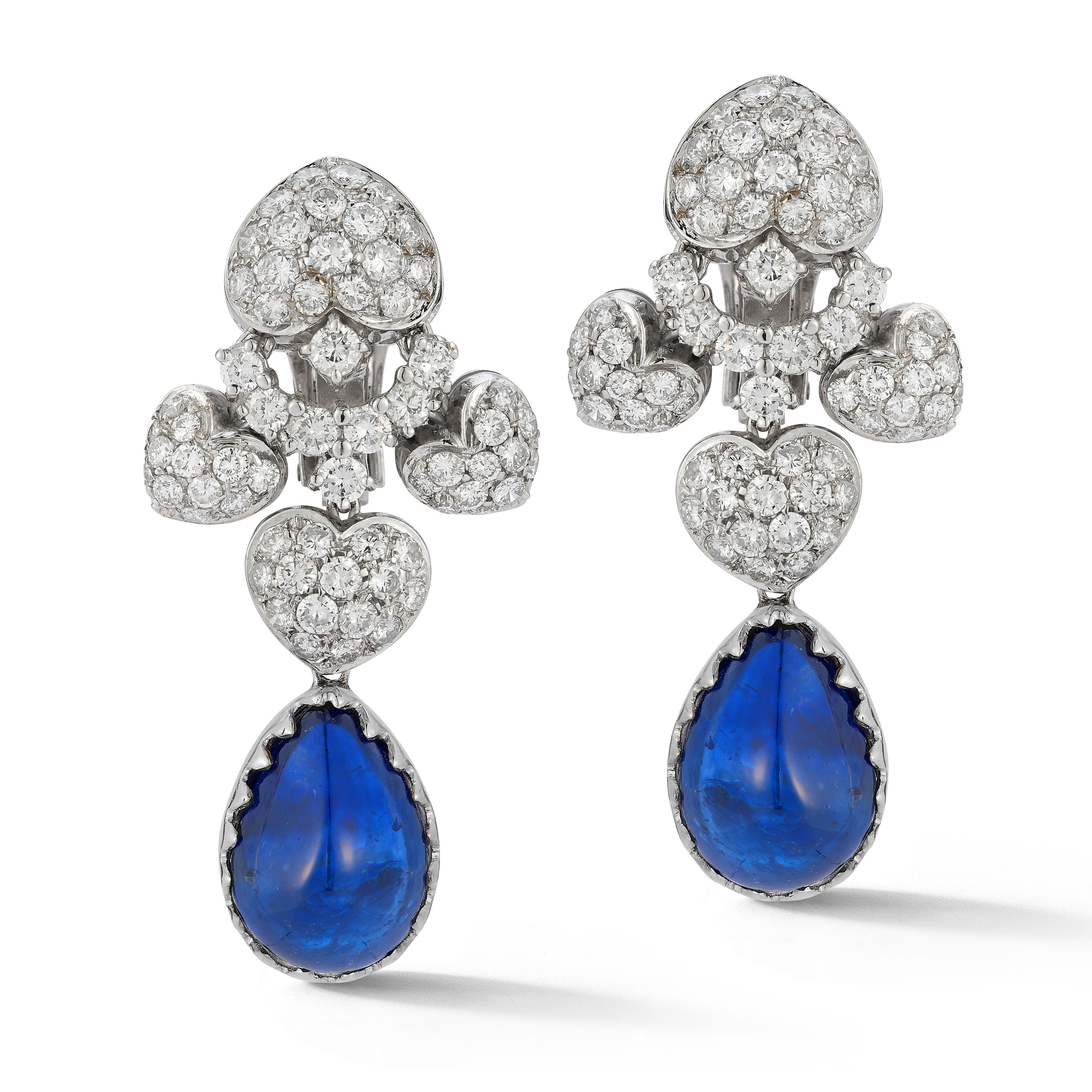 Pear Shape Cabochon Sapphire and Diamond Earrings

A pair of 18 karat white gold earrings set with 130 round cut diamonds and 2 cabochon pear shaped sapphire drops

Accompanied by an AGL report stating that one of the sapphire drops is an unheated
