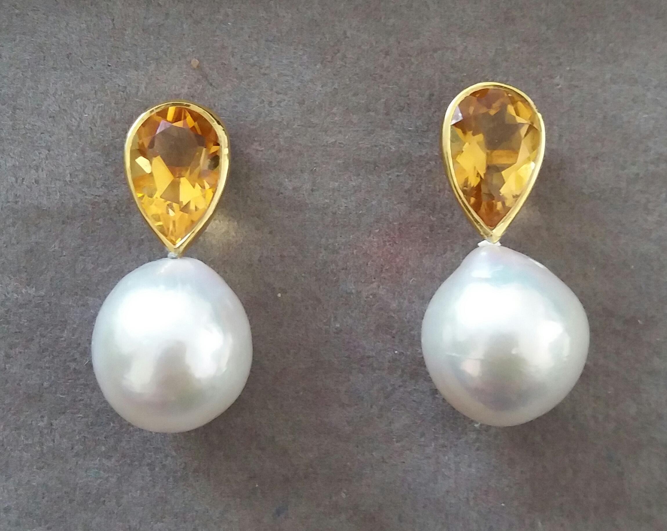 These simple but elegant and completely handmade earrings have 2 Pear Shape Faceted  Natural Citrines measuring 7 x 12 mm set in 14 Kt yellow gold bezel at the top to which are suspended 2 White Color Baroque Pearls  measuring 14 x 15 mm 

In 1978
