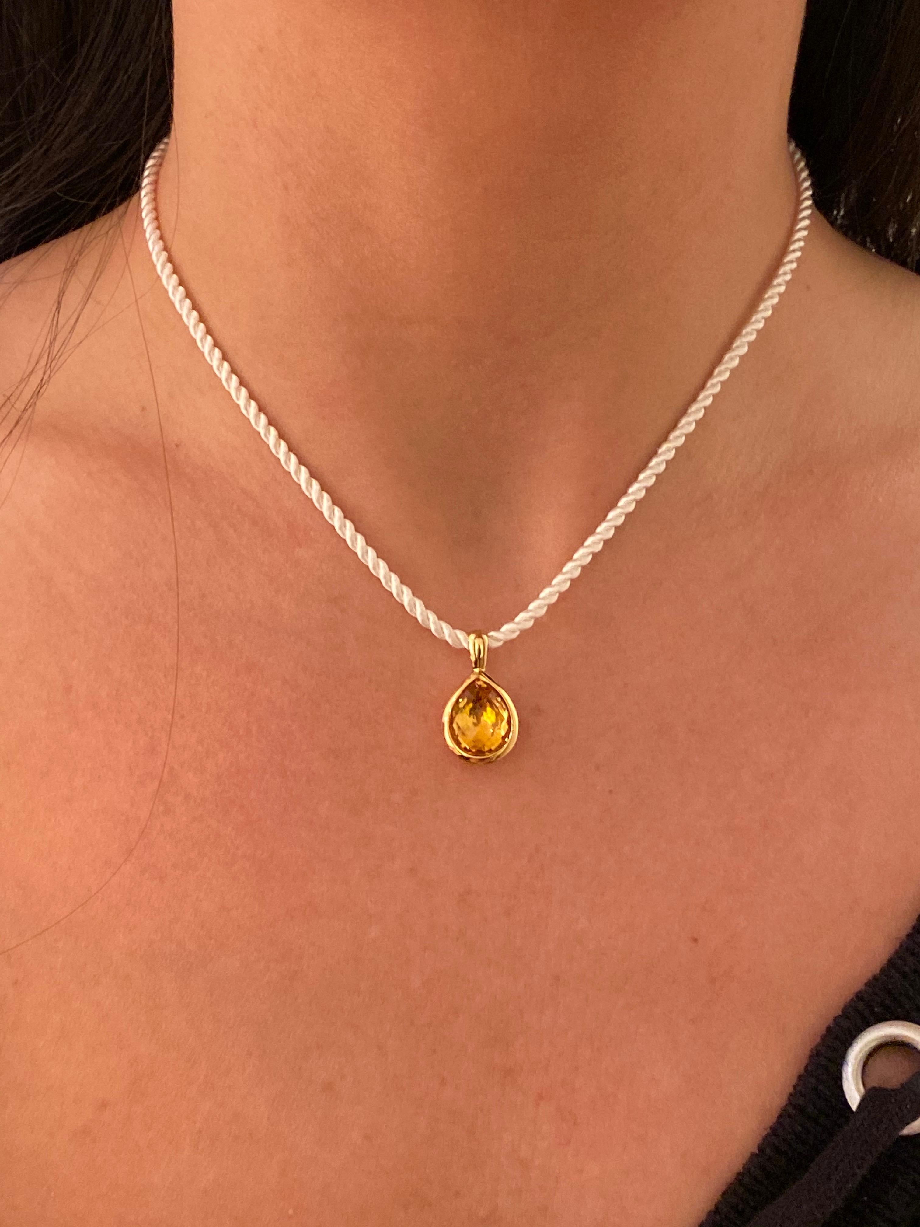 Hammerman Brothers 18 karat yellow gold pear shape citrine pendant on white silk cord. Citrine is 4.6 carats, cord length is 16