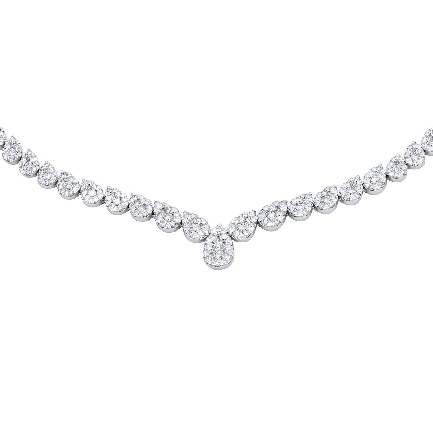 This stunning necklace is made from 203 round sparkling VS2, G color diamonds that are formed together in pear shapes. The pears are lined up on an angle making a 