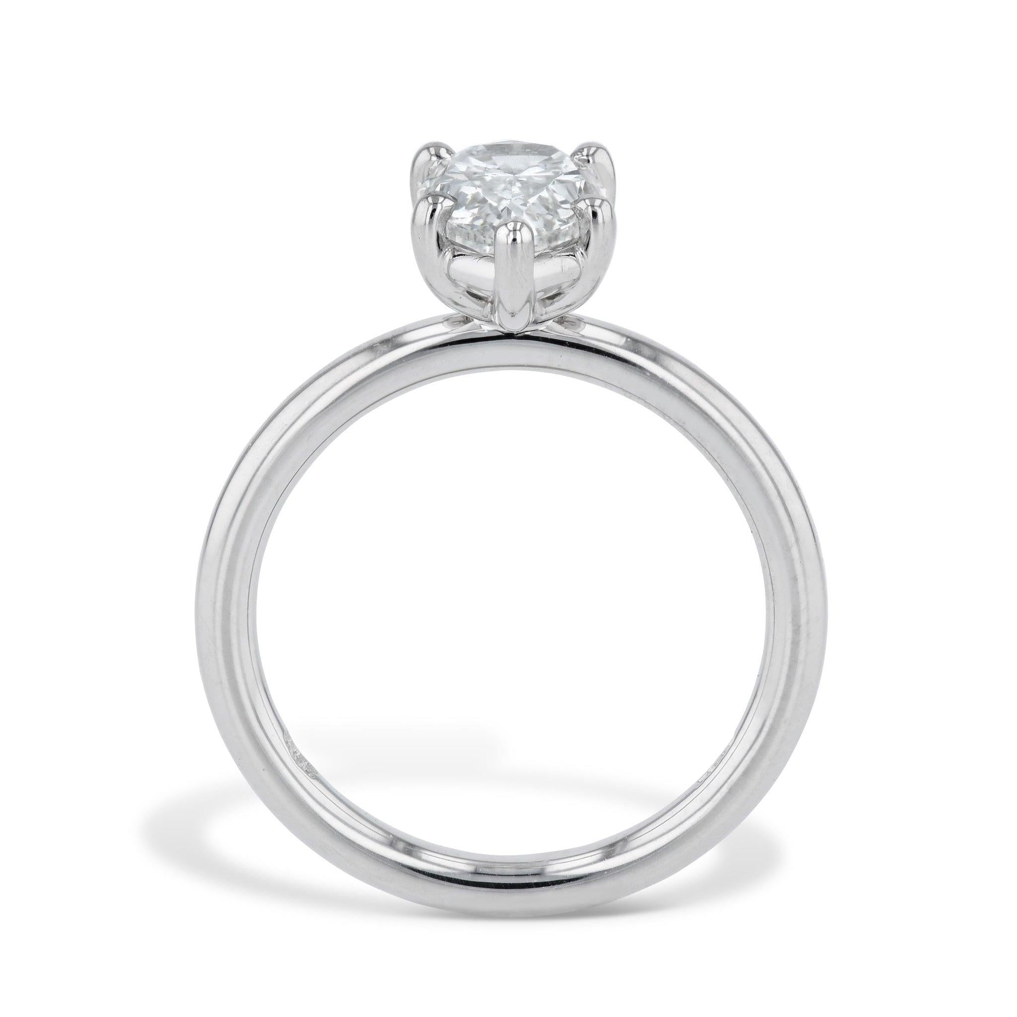 Delight in the exquisite beauty of this Pear Shape Diamond Platinum Engagement Ring. A stunning Pear Shape Diamond is magnificently prong set in Platinum and is sure to enchant! Handmade exclusively for the H&H Collection and sized to a 6, this