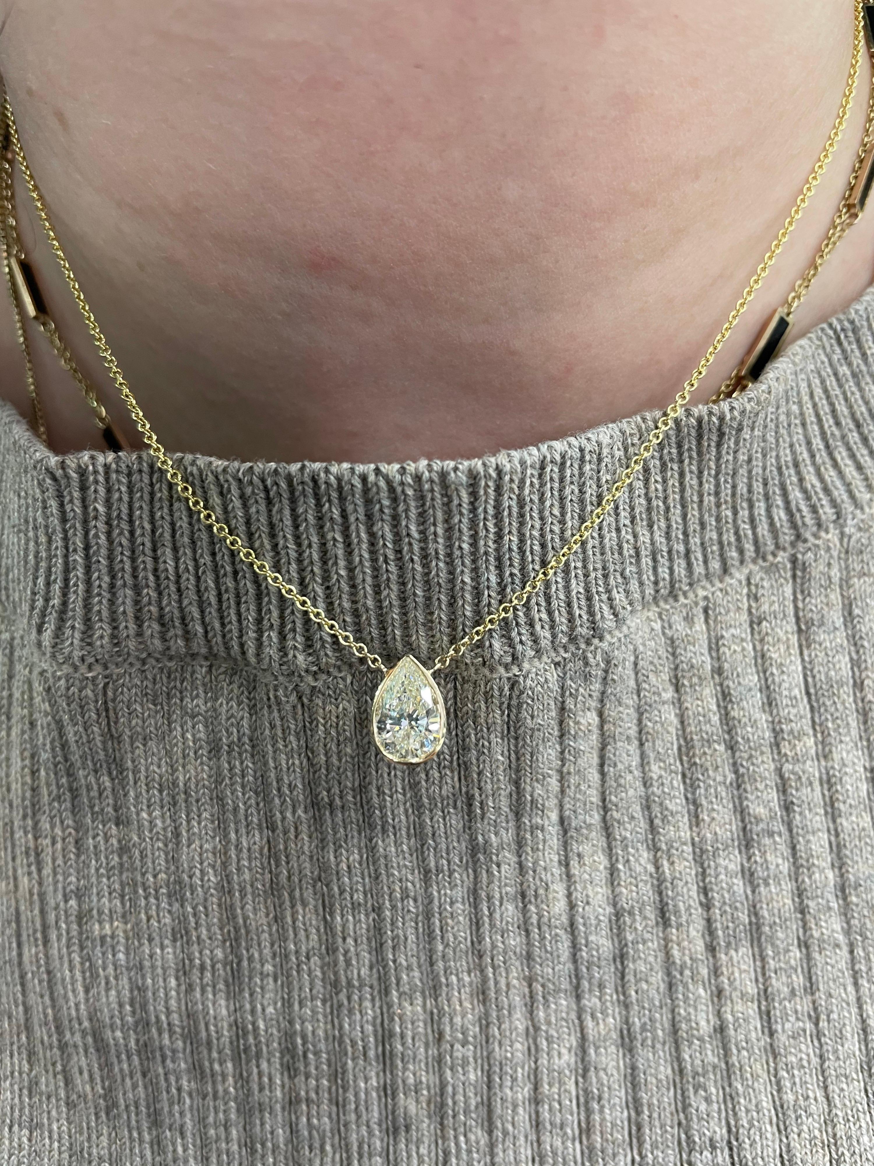 14 Karat  Yellow Gold solitaire pendant necklace featuring one Pear shape diamond weighing 1.32 carats. 
Brilliant cut stone.
Great for layering or alone. 