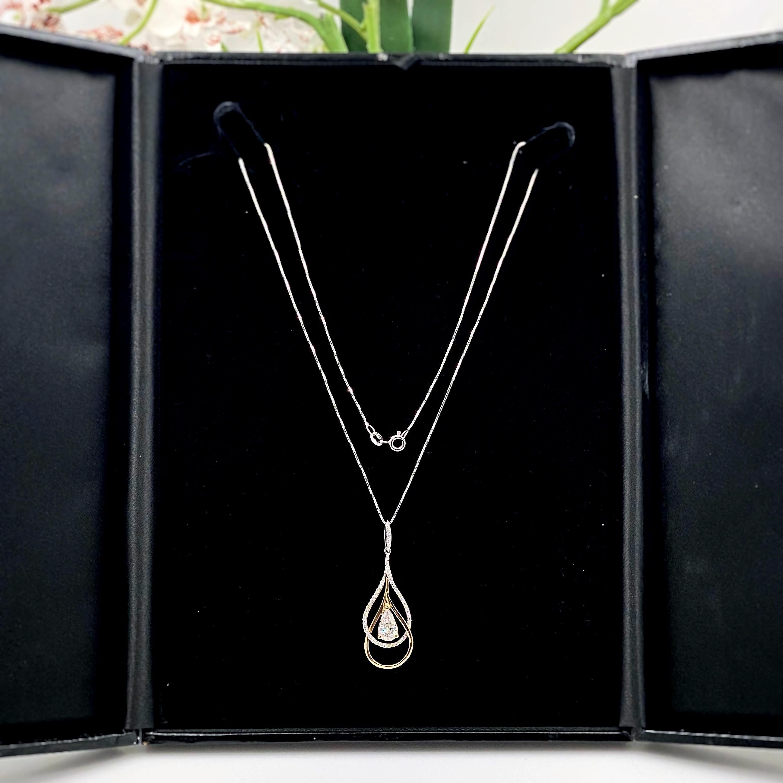 Pear Shape Diamond Pendant Necklace
Style:  Tear Drop
Metal:  14kt White & Yellow Gold
Size:  Chain is 18' inches
Pendant:  1.75 inches
TCW:  1.41 tcw
Main Diamond:  Pear Shape Diamond 1.16 cts
Color & Clarity:  F - I1
Accent Diamonds:  50 Round