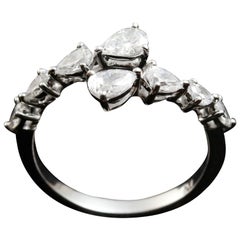 Pear Shape Diamond Wrap Around Half Eternity Ring in 18 Karat Gold