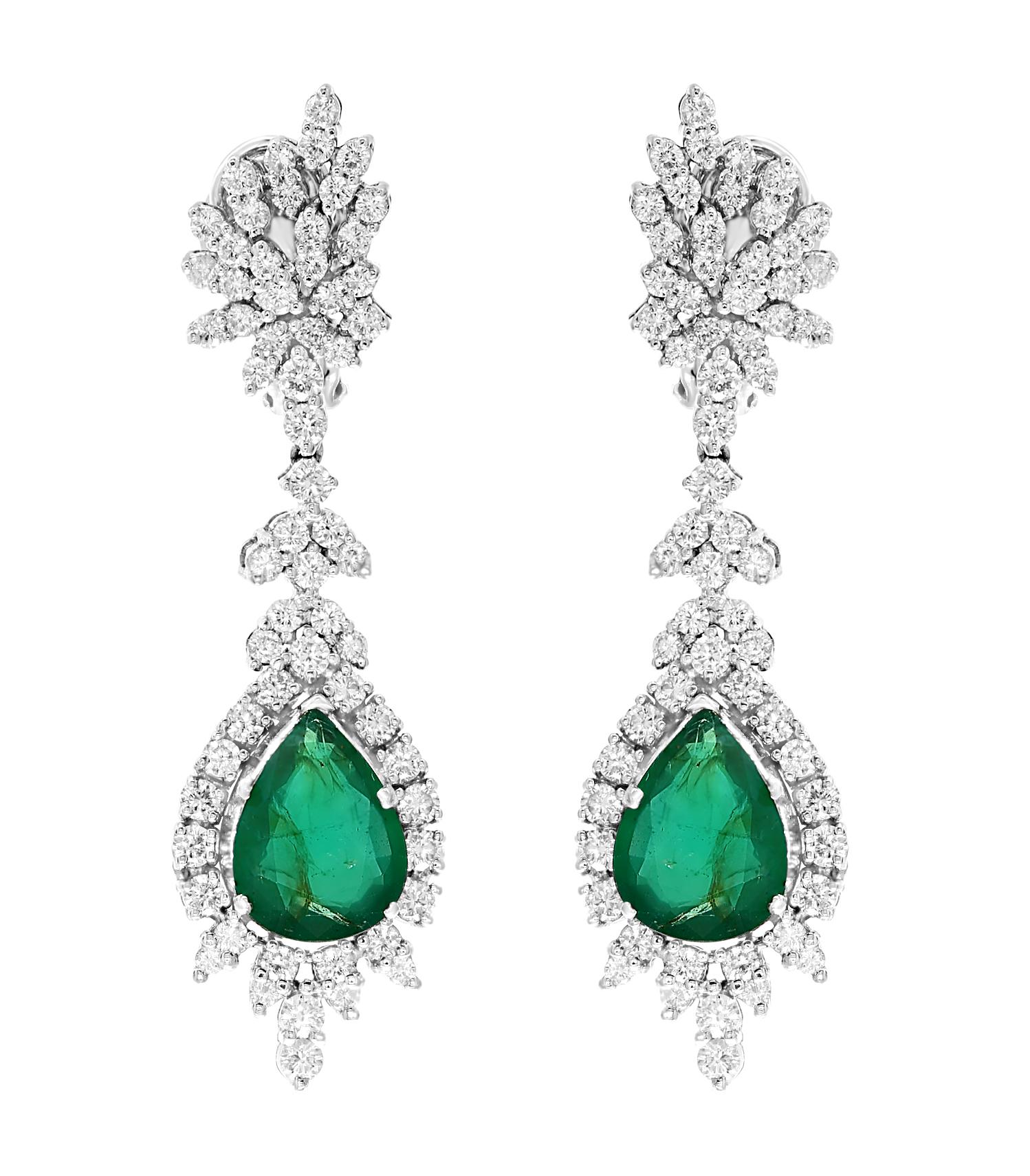  GIA Certified Pear Shape  Emerald And Diamond  Necklace And Earring  Bridal Suite Estate
This spectacular Bridal set  consisting of one large 8.6 Carat Pear shape  Emerald  in the center measuring 18.5 X 13.2 X 6.45 surrounded by brilliant cut