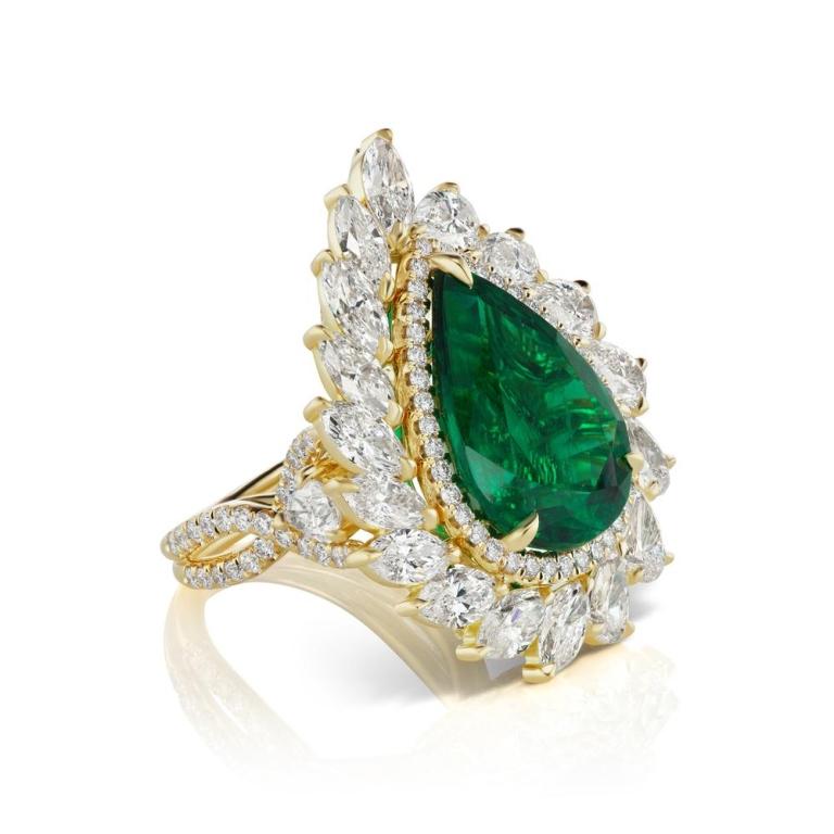 PEAR SHAPE EMERALD AND DIAMOND RING Marquis and Pear shape diamonds leave a reminiscence of the Garden of Eden surrounded by a lush Pear shaped Emerald Item: # 03227 Metal: 18k Y Lab: C.dunaigre And Grs Color Weight: 11.24 ct. Diamond Weight: 7.29