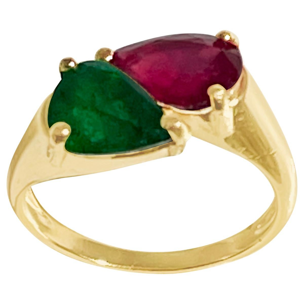 Two stone  Natural 2 Ct Emerald  and 2 Ct Treated  Ruby Engagement Ring in 14 Karat Gold Size 7
Approximately 2  Ct of pear shape   Emerald  and approximately 2 ct of treated ruby
 Two Stones  weighing approximately 4 ct total

14 Karat yellow Gold