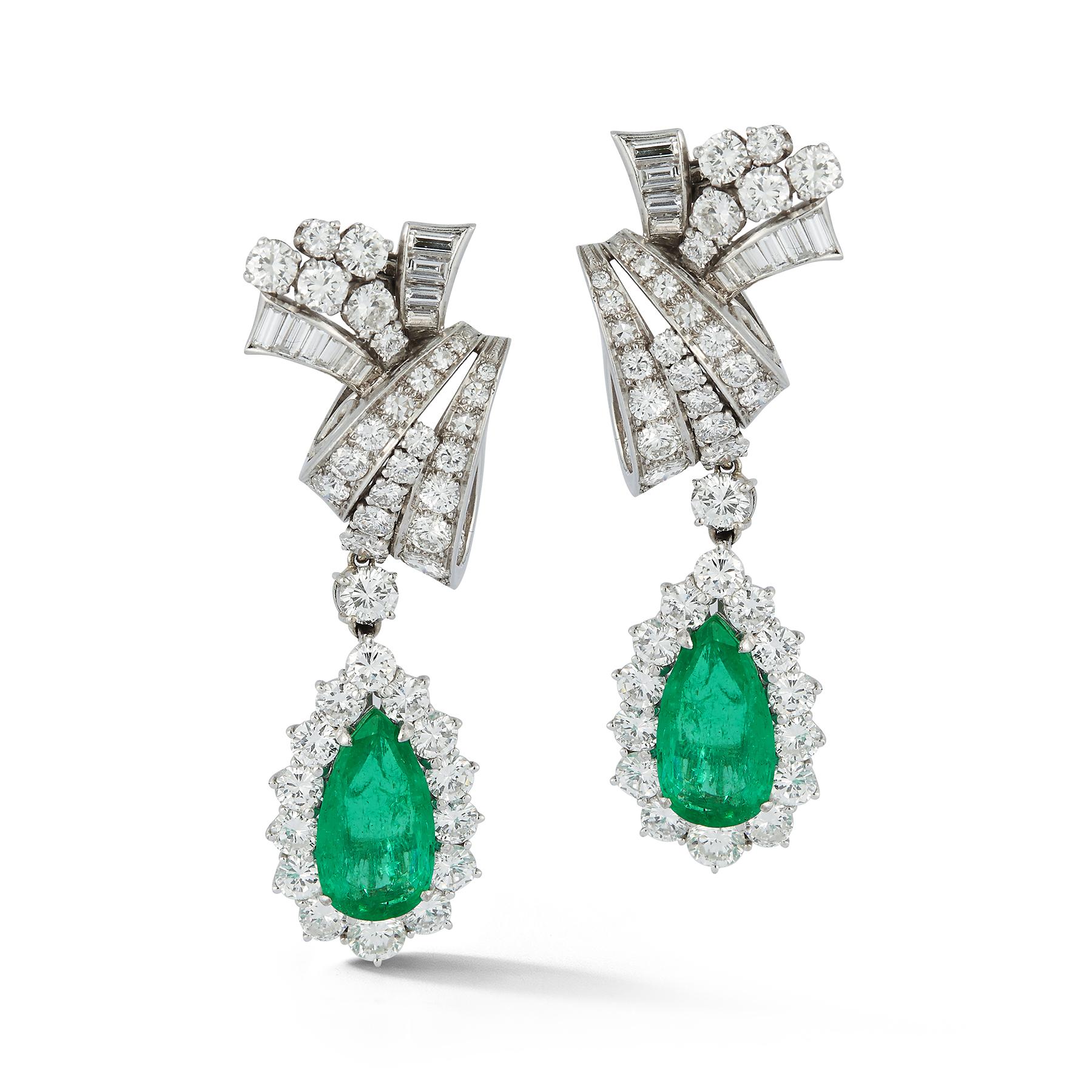 Pear Shape Emerald & Diamond Earrings, 2 pear shape emeralds approximately 3.64 cts , 20 baguette cut diamonds approximately .69 cts & 84 round cut diamonds approximately 4.62 cts set in platinum.

Measurements: 1.75