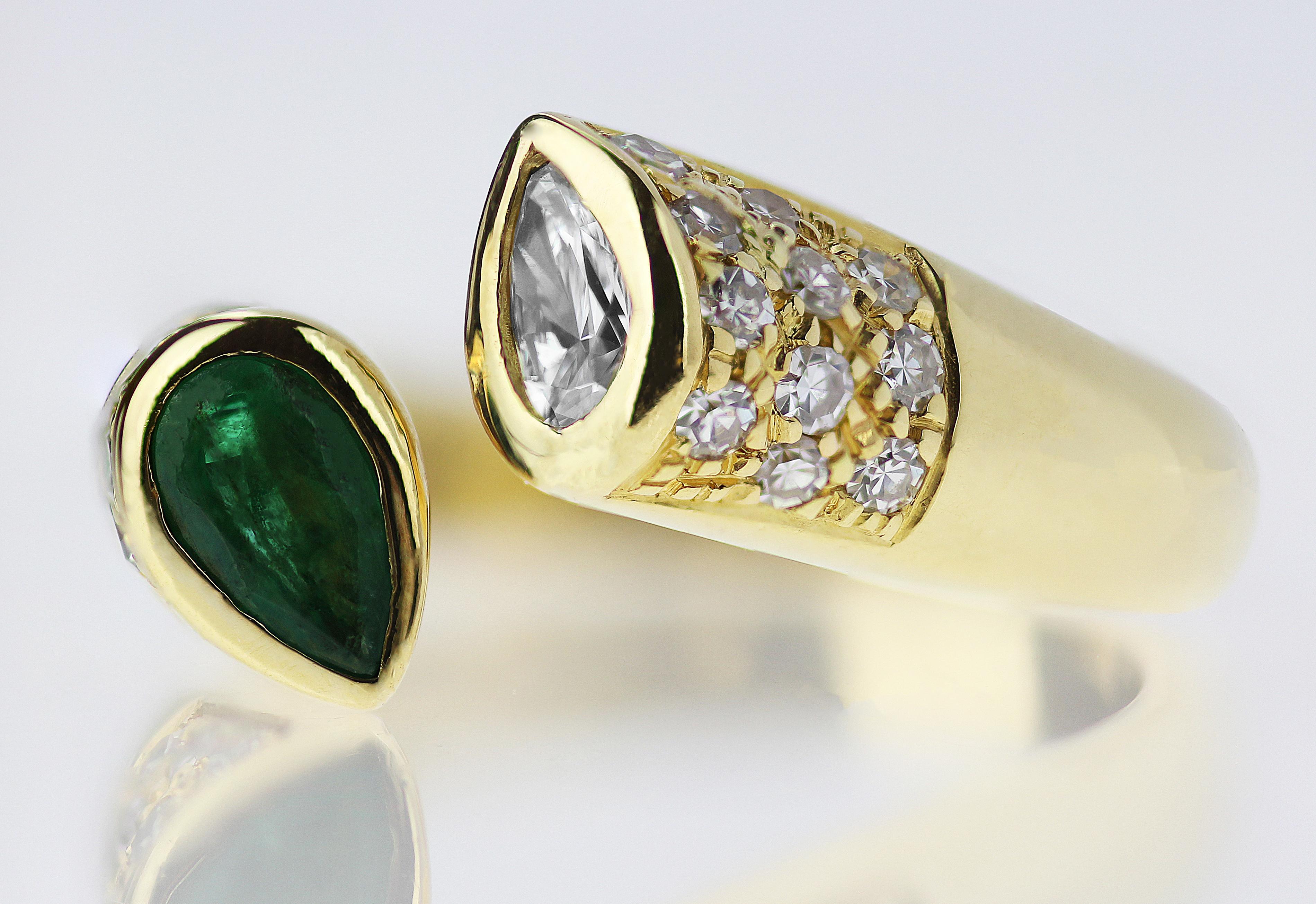Stunning, emerald and diamond ring, created with passion to be cherished with love. It is based on a peculiar open yellow gold band ring where the thickness is ascending along the ring so that it can have a seamlessly open look. The warm yellow