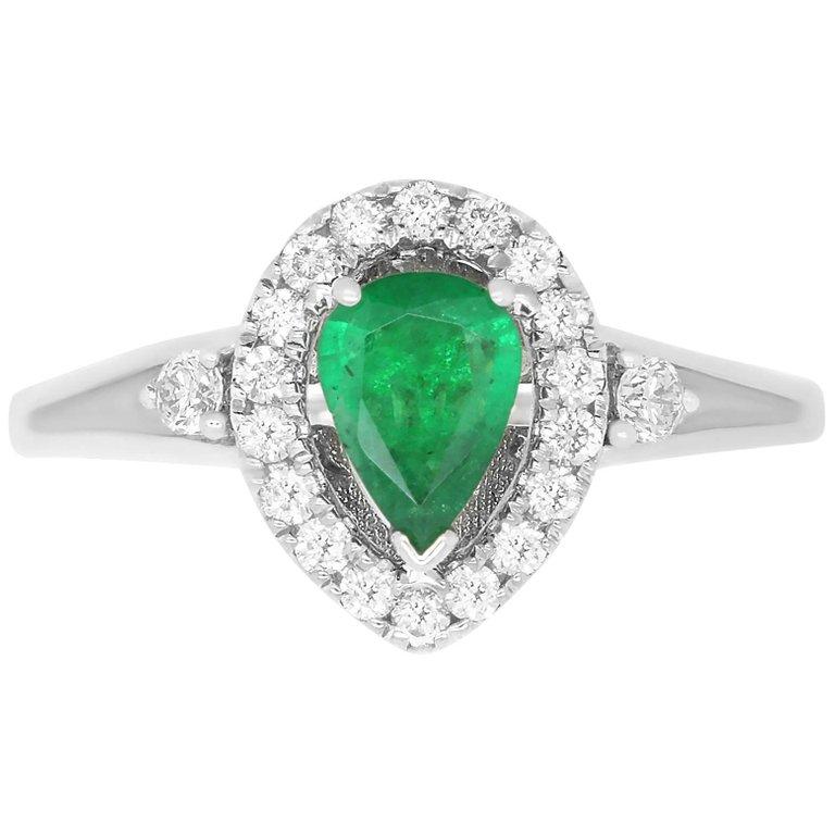 Material: 14k White Gold
Gemstones: 1 Pear shaped Emerald at 0.51 Carats. Measuring
Diamonds: 20 Round White Diamonds at 0.27 Carats
Alberto offers complimentary sizing on all rings.

Fine one-of-a kind craftsmanship meets incredible quality in this