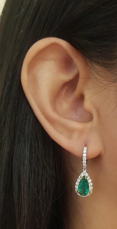 Pear Shape Emerald with Diamond Earrings Set in 18k White Gold Settings