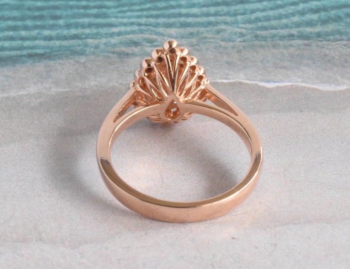rose gold pear shaped engagement ring