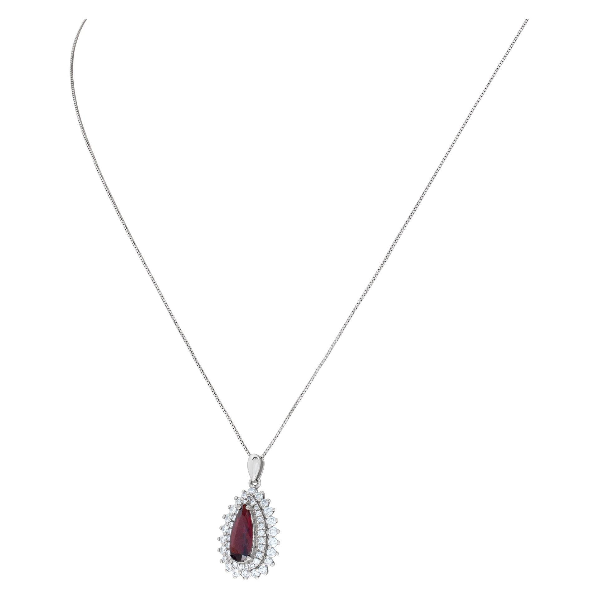 Women's Pear shape Garnet pendant surrounded by diamonds set in 18K white gold, w/ 16