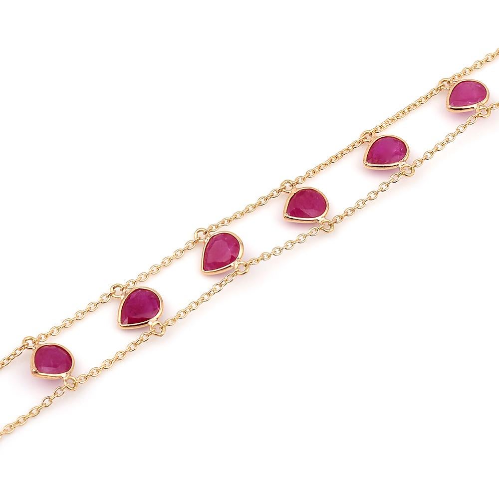 A Pear-Shape Genuine Ruby Double Line 18k Yellow Gold Adjustable Bracelet. 
The length of the bracelet can either be 6.75