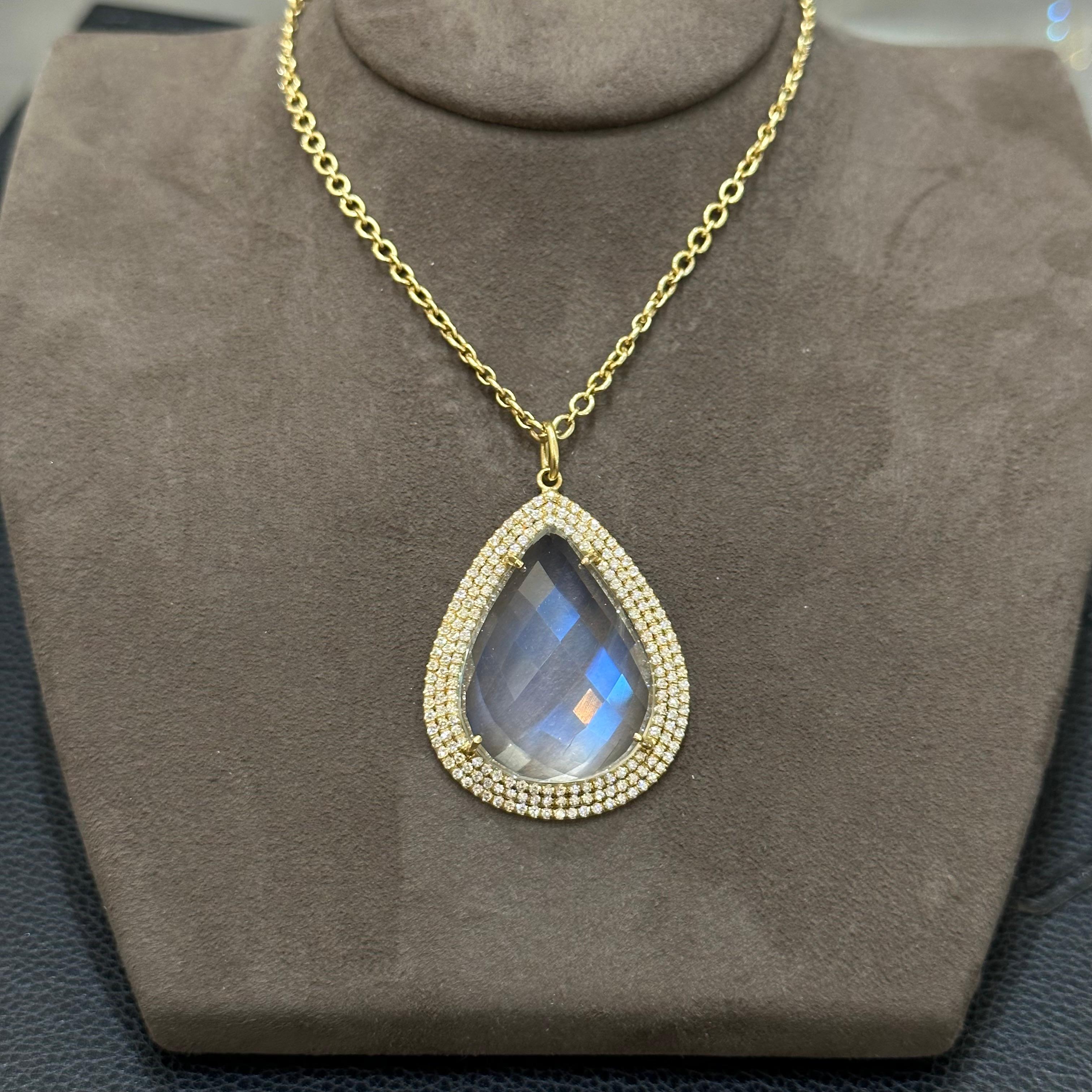 18K Yellow Gold Rose Cut Pear Shape Moonstone Pendant with Round Brilliant Diamonds. Comes on Yellow Gold Chain.
The moonstone has caterpillar inclusion on the side, barely noticeable from the front. If you look at the back of the moonstone, you can