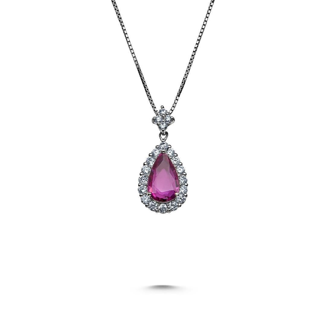 Elevate your style with the captivating Platinum Pendant featuring a Pear Shape Mozambique No Heat Pink Sapphire embraced by a Diamond Halo. At the heart of the pendant lies a stunning 2.04-carat Pink Sapphire from Mozambique, renowned for its