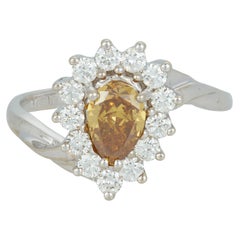 Anello di fidanzamento aureolato con diamante giallo naturale a forma di pera in oro bianco 14 carati