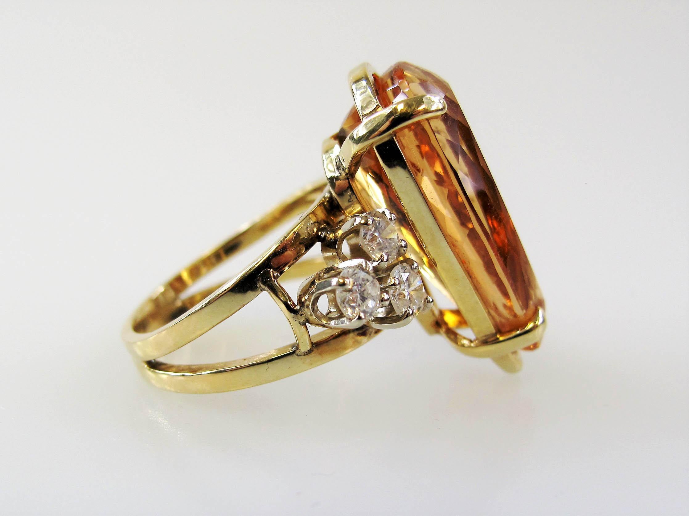 Ring size 8.75

This exquisite imperial topaz and diamond ring is an absolute showstopper. Featuring an eye-catching pear mixed cut topaz stone, as well as shimmering diamond accents, this stunner of a ring makes a bold statement with both its