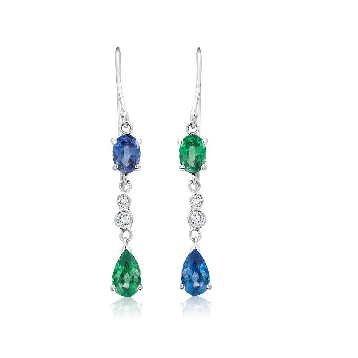 Fourteen karat white gold one inch and a quarter hoop drop earrings 
Alternating mirror oval shape and pear shape sapphire and emerald 
Pear Shape and oval shape Sapphire weighing 1.20 carat 
Pear shape and oval emerald weighing 1.00 carat
Diamond