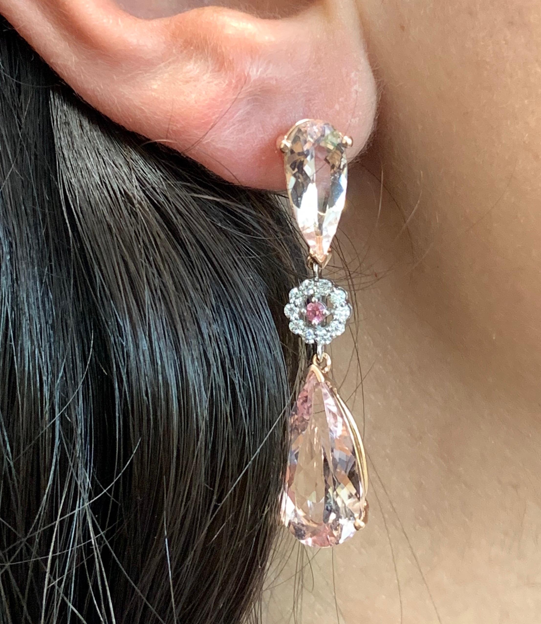 Material: 14k Two Tone
Center Stone Details: 4 Pear Shaped Pink Morganites at 12.10 carats  
Stone Details: 2 Pink Tourmalines at 0.06 Carats
Diamond Details: 20 Round White Diamonds at 0.23 Carats - Clarity: SI / Color: H-I

Fine one-of-a-kind