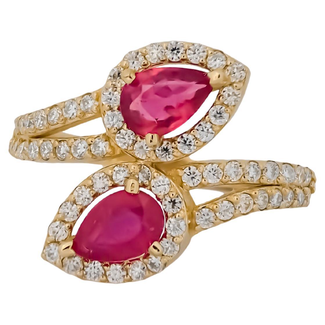 Anillo de oro de 14k con rubíes en forma de pera.