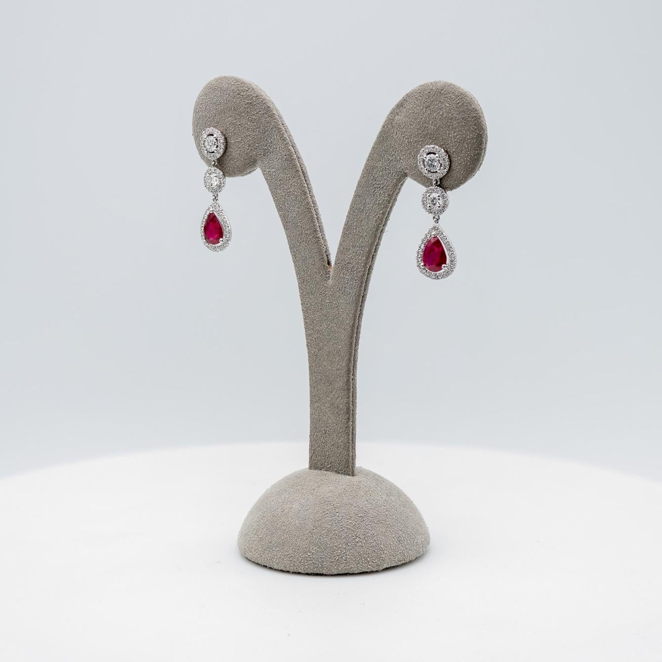 Women's Pear Shape Ruby and Diamond Halo Dangle Earrings For Sale