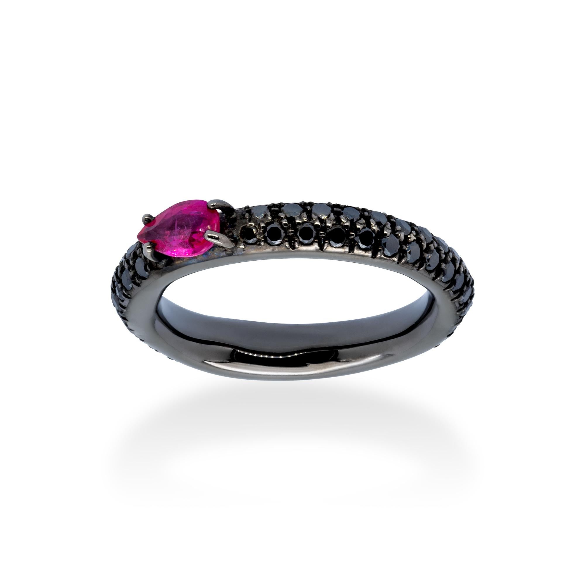 A Ring from d'Avossa Rainbow Collection in black 18 kt gold with a pavé of 0.85 cts of black diamonds and a central pear shape ruby of 0.46 cts  

This Ring has been designed to be worn alone, or together with one or more rings of the same