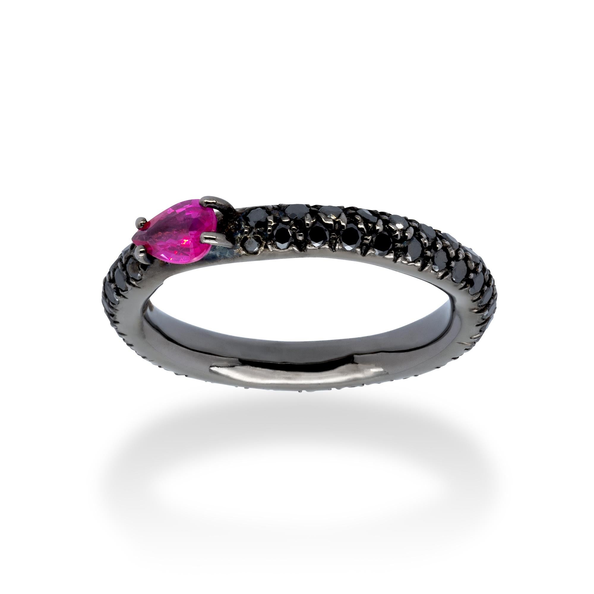 A Ring from d'Avossa Rainbow Collection in black 18 kt gold with a pavé of 1.25 cts of black diamonds and a central pear shape ruby of 0.46 cts.

This Ring has been designed to be worn alone, or together with one or more rings of the same