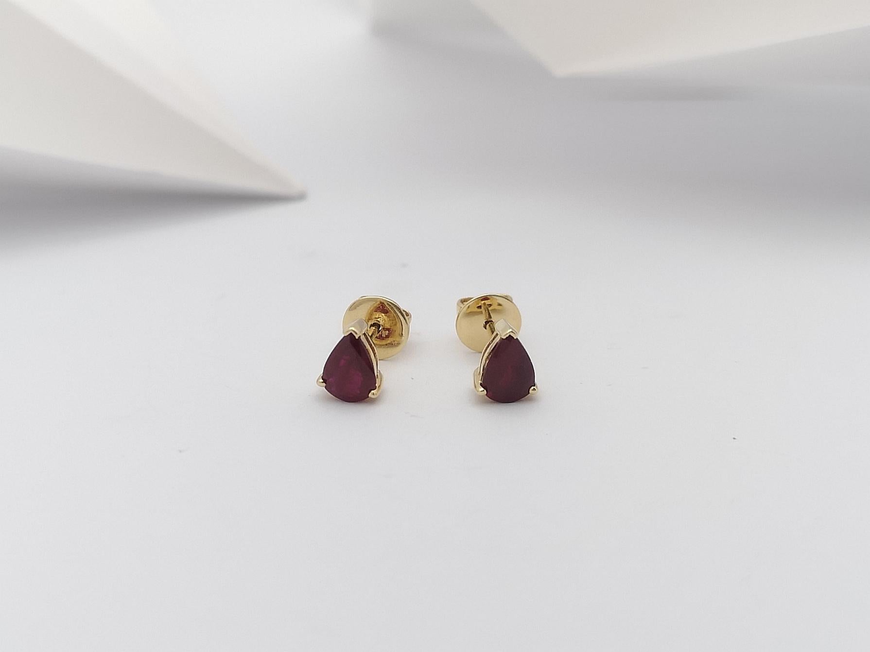 Pear Cut Pear Shape Ruby Stud Earrings Set in 14 Karat Gold Settings For Sale