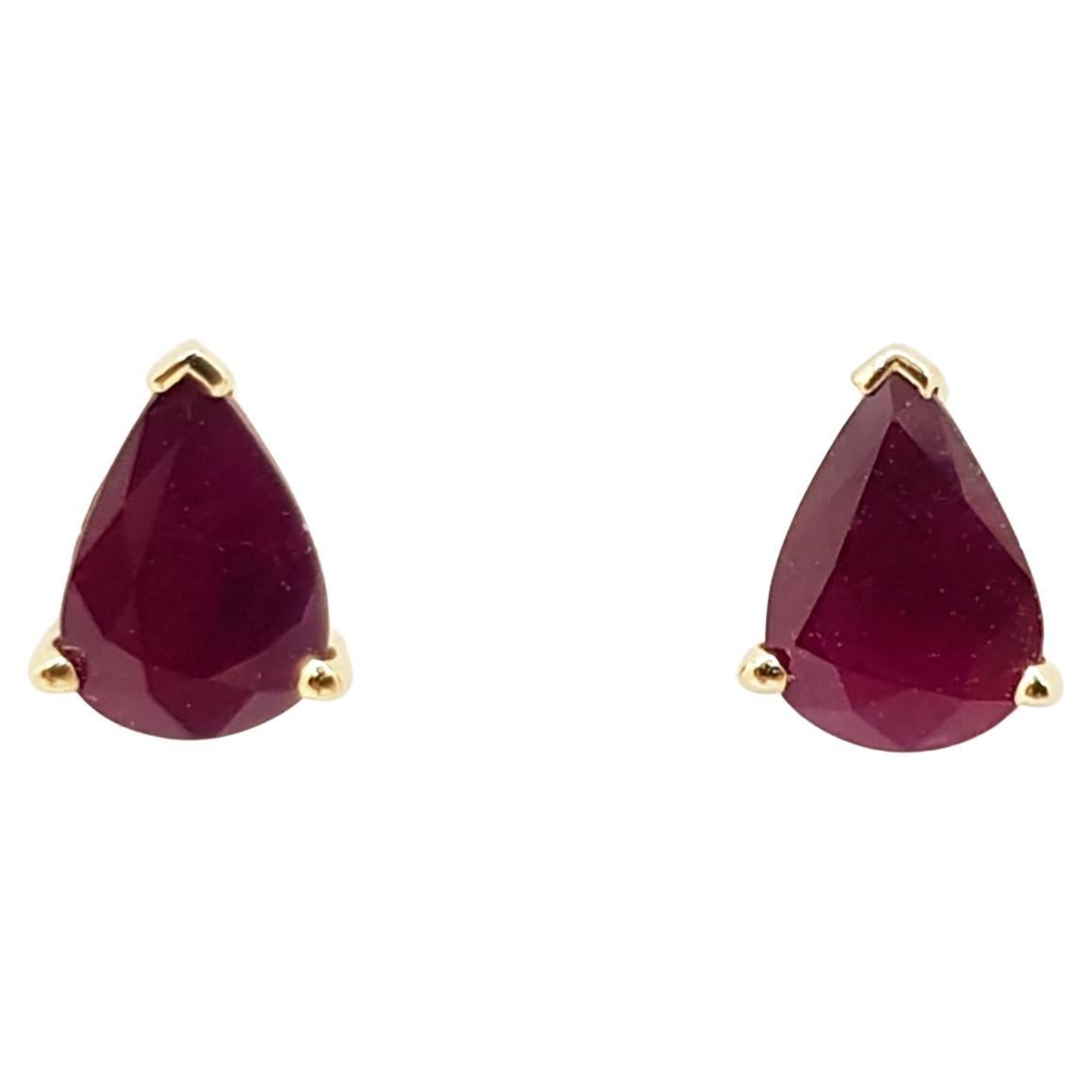 Pear Shape Ruby Stud Earrings Set in 14 Karat Gold Settings For Sale