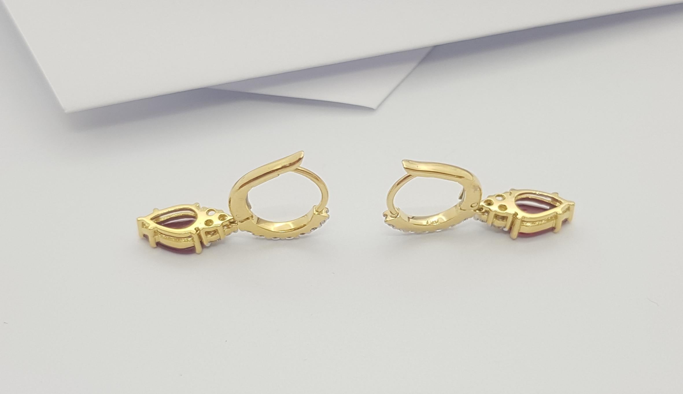 Women's Pear Shape Ruby with Diamond Earrings Set in 18k Gold Settings For Sale