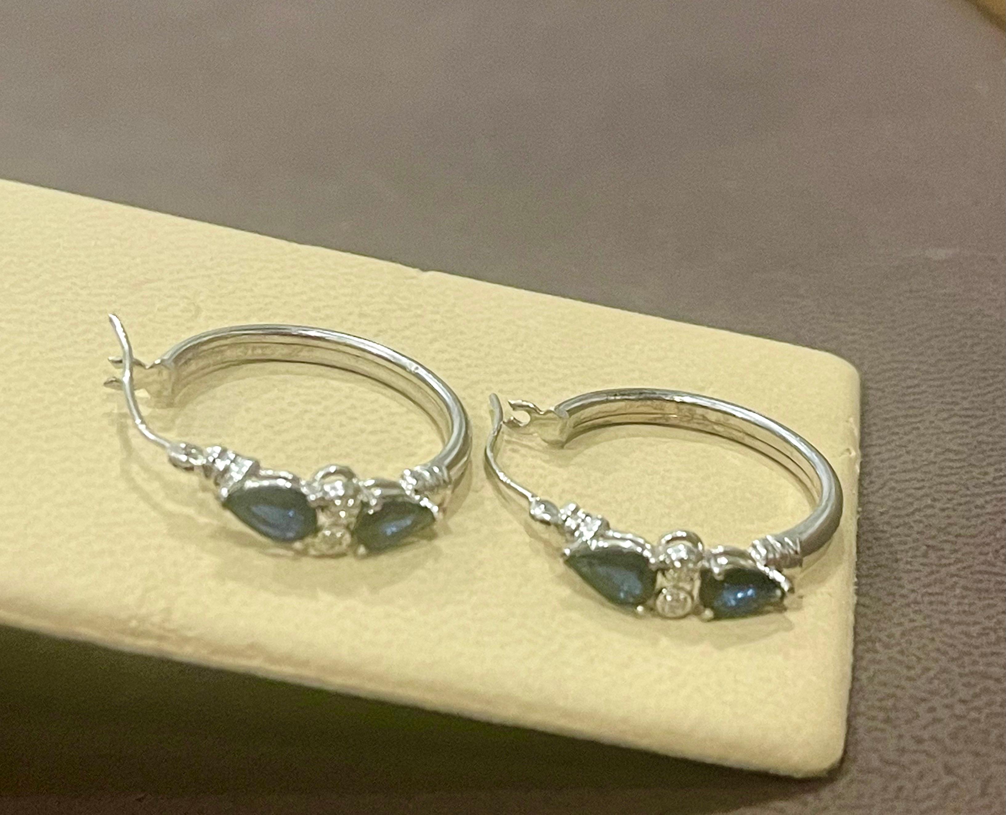 Women's Pear Shape Sapphire and Diamond Hoop Cocktail Earrings in 14 Karat White Gold For Sale