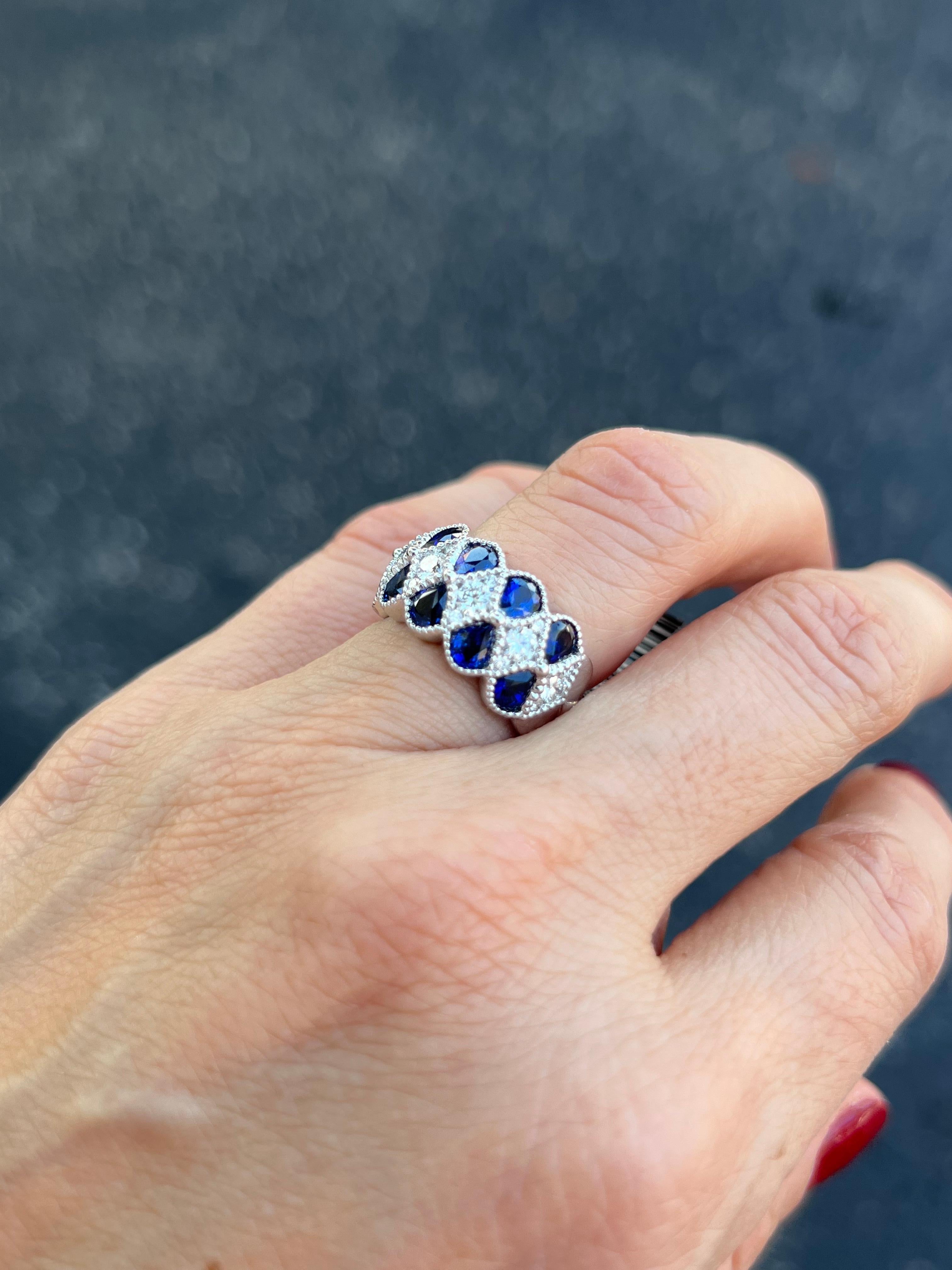 Contemporary Pear Shape Sapphires and Diamonds Band Ring For Sale